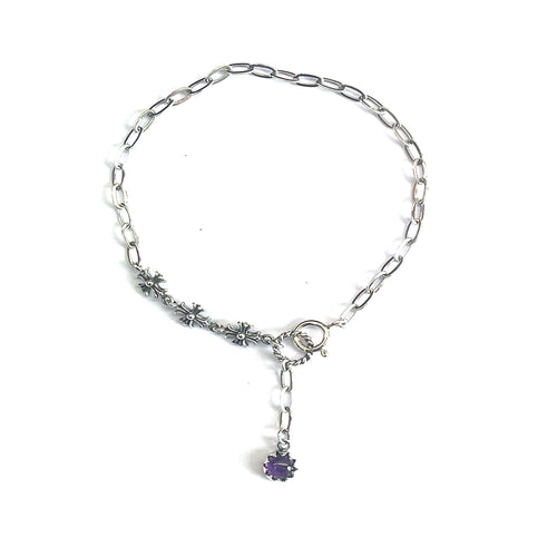 Silver bracelet with cross pattern & purple stone