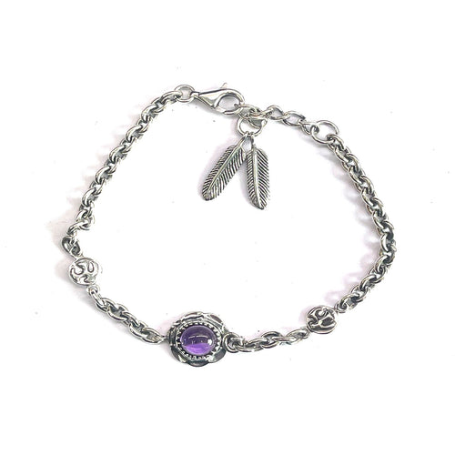 Silver bracelet with feather & big purple stone