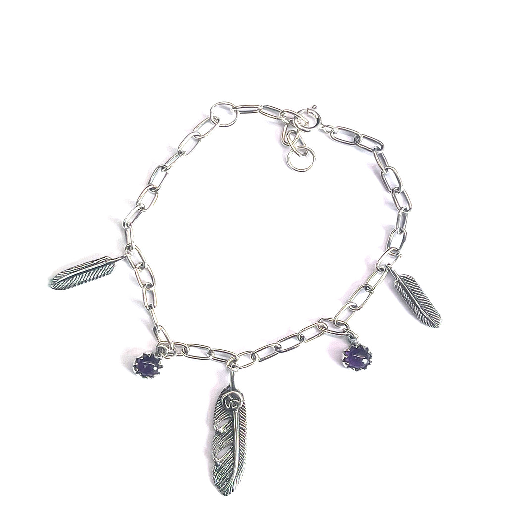 Silver bracelet with  purple stone & feather