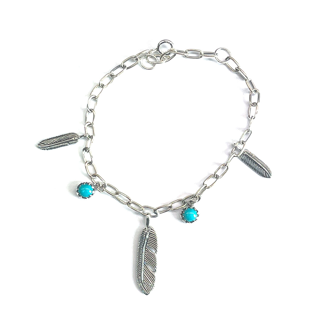 Silver bracelet with  turquoise & feather