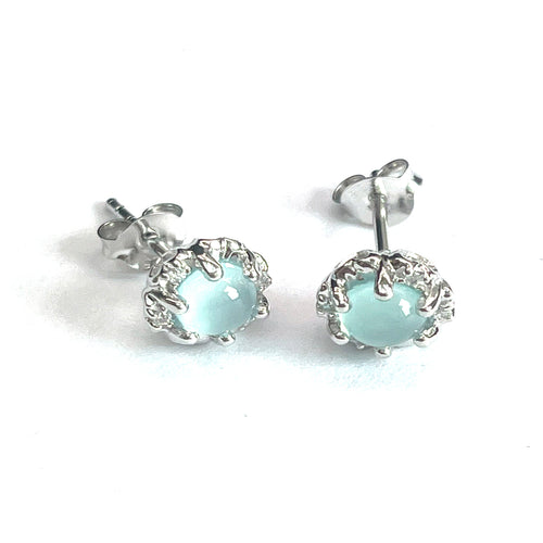 Silver stud earring with light blue stone