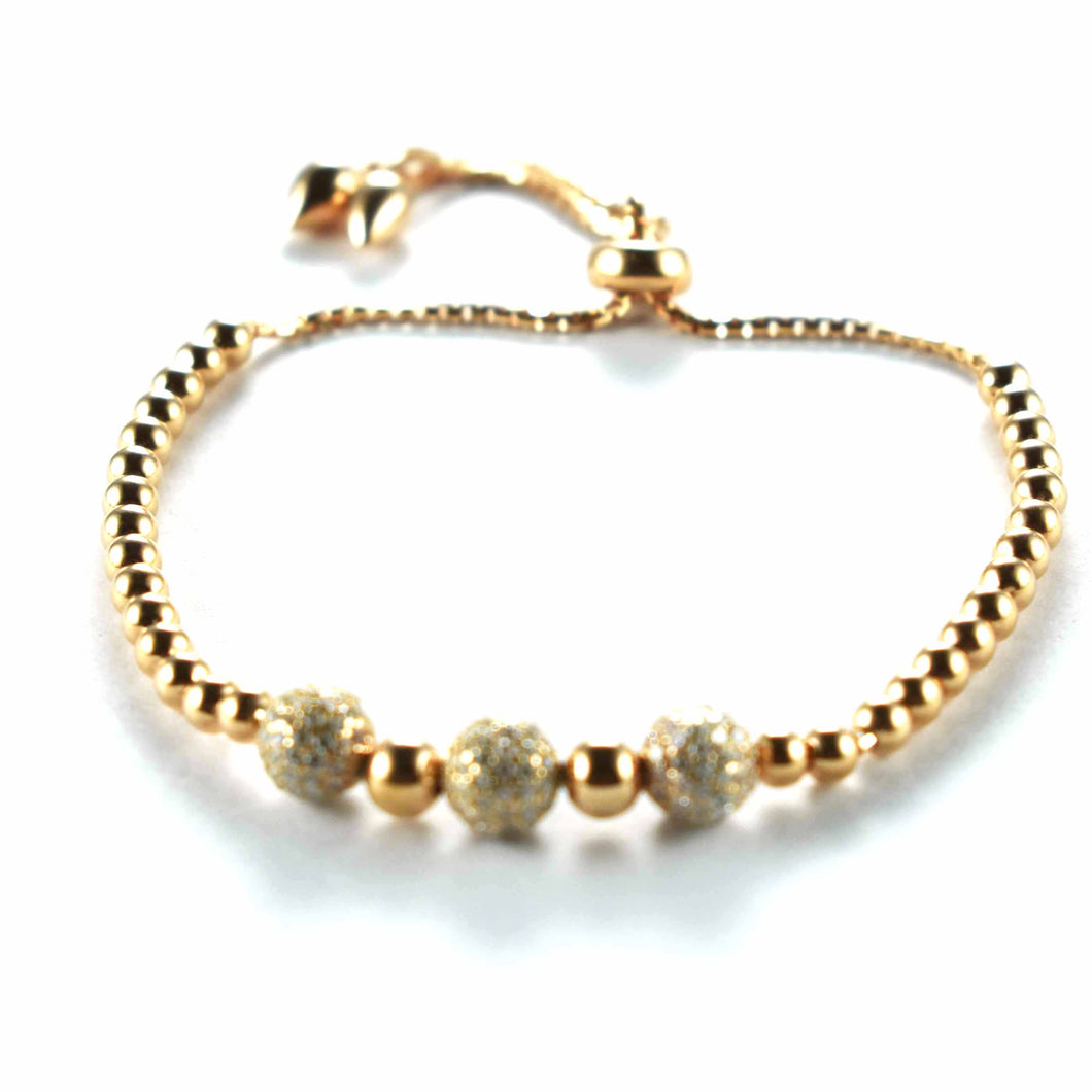 Silver bracelet with diamond cut ball and pink gold plating